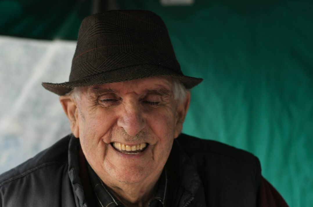 Portrait of a smiling elderly Swiss man with glasses