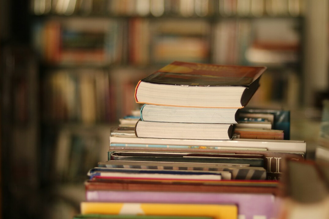 Older adults discussing a book together in a cozy reading corner