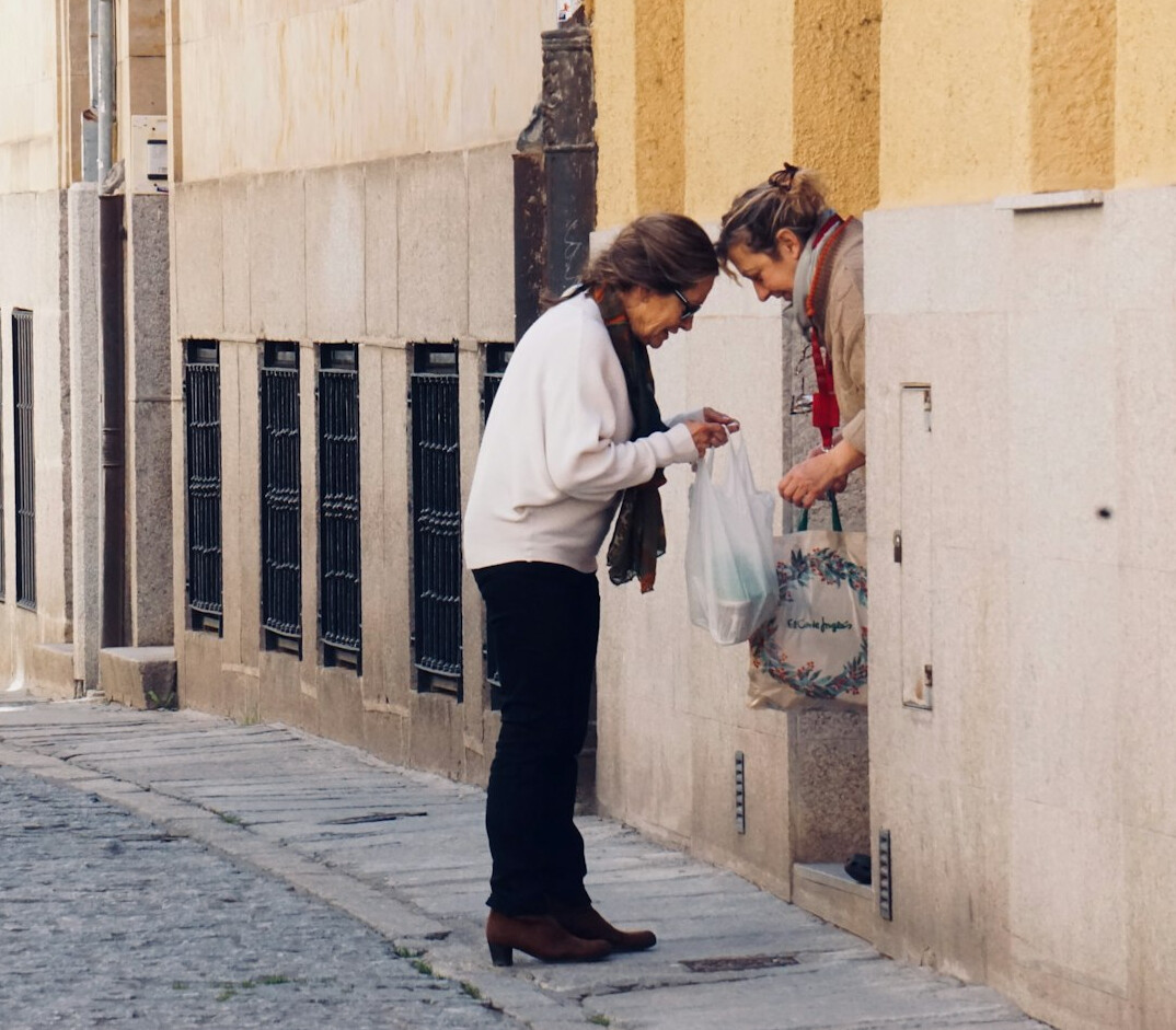 senior woman smiling with neighbor