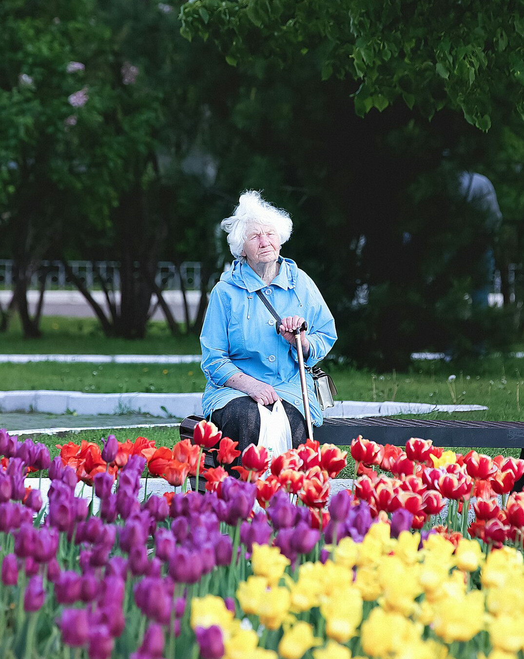 elderly woman smiling in garden