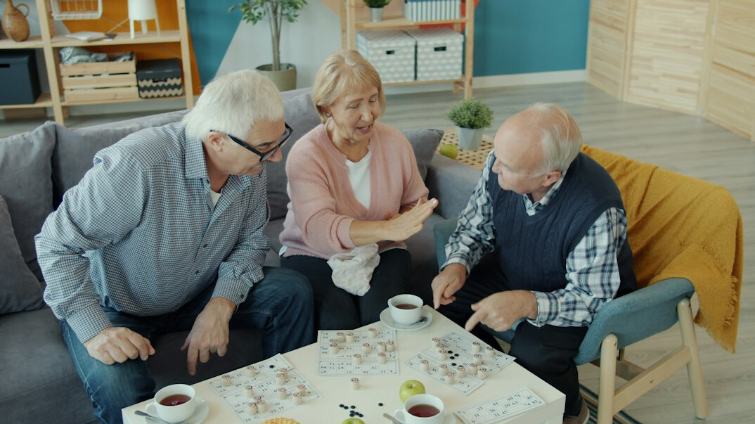 senior residents chatting in living room